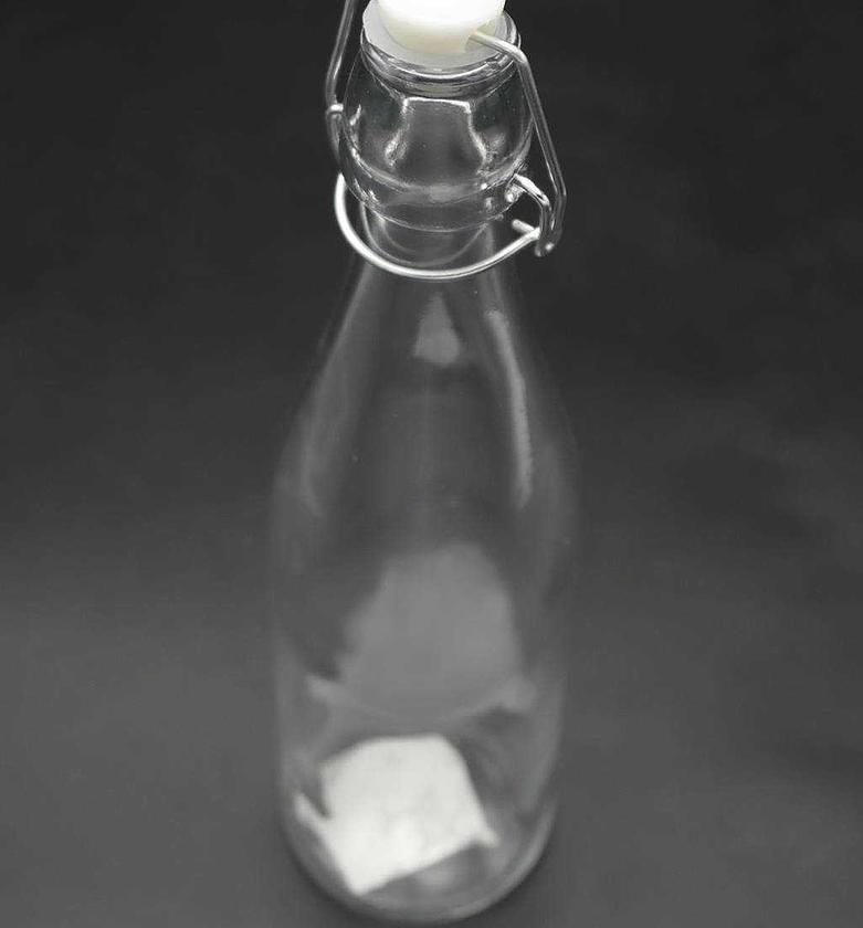 GLASS BOTTLE WITH COVER image