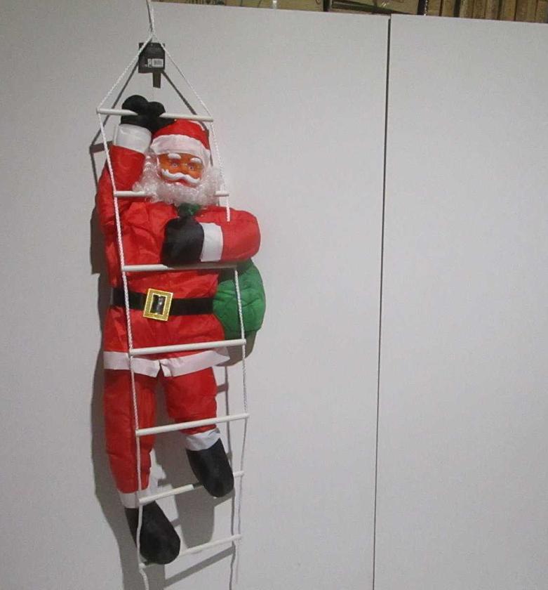 Christmas climbing santa ladd image